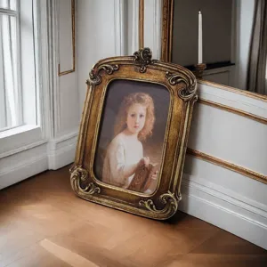 Detailed view of the ornate golden vintage resin picture frame with classic portrait