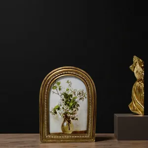 Vintage arched gold picture frame with delicate floral oil painting