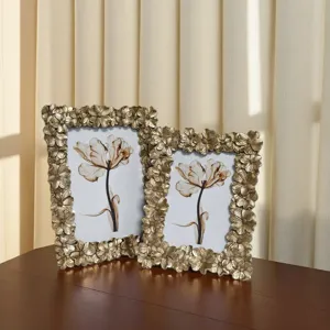 Retro resin picture frame with 3D floral border, elegant vintage photo display for home decor.