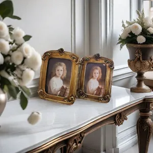 Vintage gold resin picture frames with intricate French scrollwork in lifestyle setting