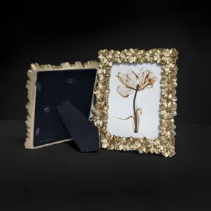 Detailed view of European retro resin photo frame in gold with exquisite floral relief design.