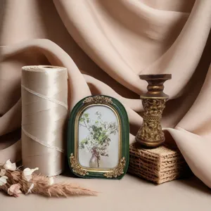 Detailed view of a vintage French resin picture frame with golden floral relief