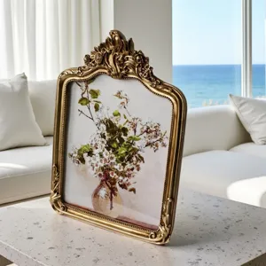 Vintage French style gold ornate decorative picture frame with floral art print for room decor.
