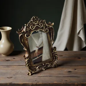 Detailed macro view of a vintage French gold resin frame with ornate relief carvings