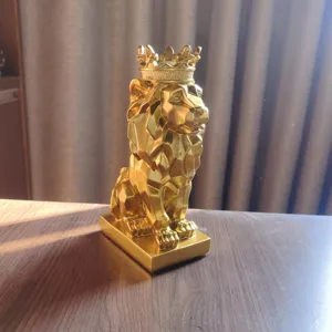 Gold geometric lion figurine with crown, resin animal sculpture for living room desktop decor
