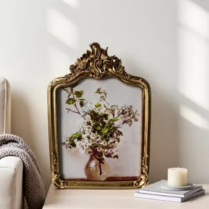 Vintage gold decorative picture frame with floral art print, elegant wall and desk decor.
