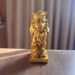 Gold geometric lion statue with crown, luxury resin animal figurine for living room desk decor.