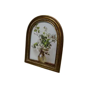 Vintage luxury golden arch photo frame with embossed edge and elegant floral art print for home