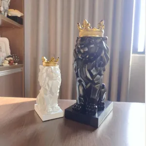 Geometric lion statue resin ornament with gold crown for modern living room home decor.