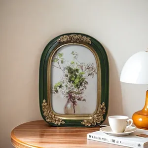 Vintage French style green and gold resin picture frame with elegant floral art