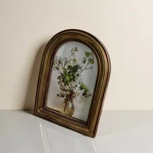 Elegant vintage French palace style arched embossed resin photo frame in distressed gold