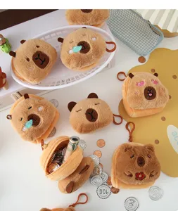 Detailed shot of several capybara plush coin purses in different expressions