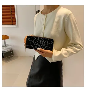 Stylish black long zipper clutch wallet featuring a white spider web and heart print detail.