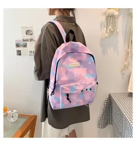 Detail view of a pastel purple canvas backpack with stylish metal chain detail.