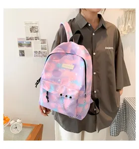 Macro view of a stylish purple cloud pattern school backpack with chain detail for girls