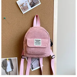 Pink corduroy mini backpack for women with front pocket and adjustable straps