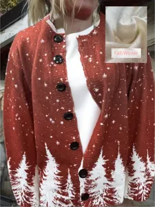 Close-up of red Christmas knit cardigan with white pine tree and snowflake print