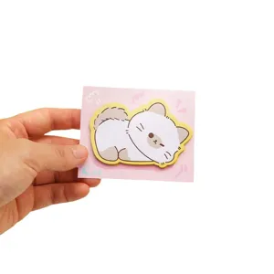 Cute cat-shaped die-cut sticky notes for students shown held by hand on white background