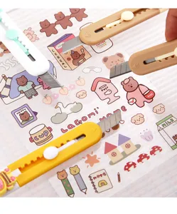 Mignon mini cutter de poche utilitaire cutter de papier de dessin animé pour papeterie.