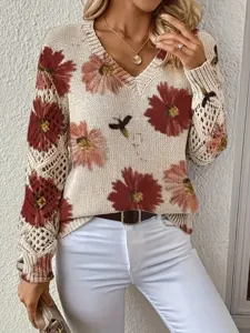 Detailed view of an elegant bohemian floral V-neck sweater featuring hollow knit sleeves.