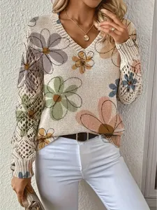 Close-up of bohemian floral knit sweater featuring elegant V-neck and long sleeves