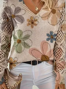 Detailed view of bohemian floral V-neck knit sweater featuring hollow-out lace sleeves.