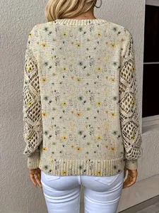 Back view of bohemian floral print knit sweater with intricate hollow-out sleeve details