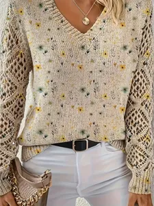Detailed view of bohemian floral knit sweater with elegant V-neck and crochet sleeves