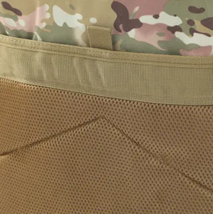 Macro view of breathable mesh back padding and durable camouflage fabric on tactical backpack
