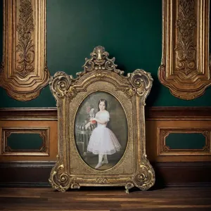 Close-up detail of ornate vintage gold resin picture frame displayed in classic interior
