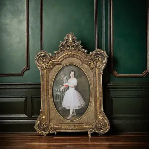 Close-up of an ornate vintage gold resin photo frame featuring a classical portrait painting