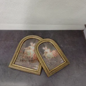 Detailed view of vintage gold arched resin picture frames with twisted rope texture