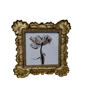 Vintage embossed gold photo frame for home decor, antique style picture frame for desktop.
