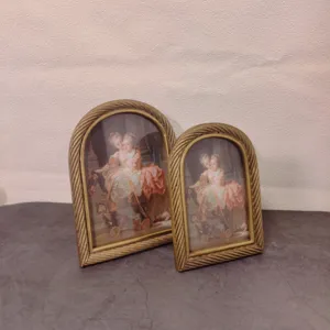 Vintage European arched gold frames featuring twisted rope borders and classic portraits
