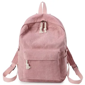 Mochila minimalista de pana rosa para mujer con gran capacidad y detalle de borla de cuerda