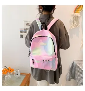 Detailed view of the gradient pastel canvas backpack worn by a student in a lifestyle setting