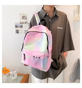 Detail shot of a gradient pastel school backpack with decorative silver chain.