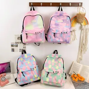 Variety of pastel color school backpacks with metal chain decorations on display