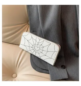 Detailed view of white long zipper wallet featuring unique black spiderweb and heart print