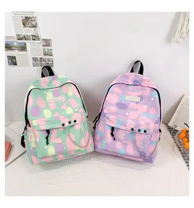 Pair of pastel canvas school backpacks for teen girls with chains and heart patterns