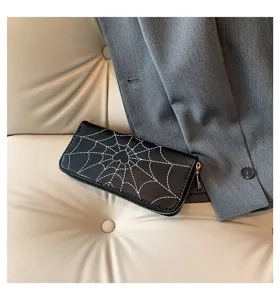 Elegant black long wallet featuring a white spiderweb print and gold zipper detail