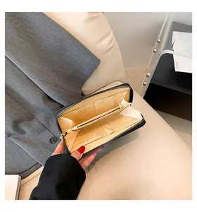 Internal view of women's long zipper wallet showing multi-card slots and compartments.