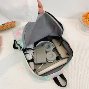 Detailed interior view of a large capacity pastel canvas backpack for students.