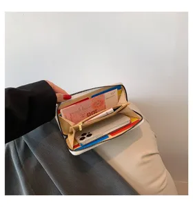 Detail view showing the spacious interior compartments of this long zip-around wallet.
