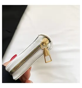 Detail shot of the durable gold metal zipper on a white leather women's clutch