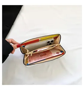 Detail view showing the large internal capacity of the long zipper clutch wallet.