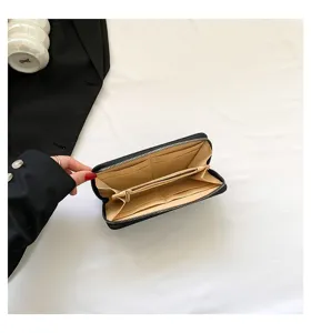 Interior view of women's long zip-around wallet showing multiple card slots and zipper pocket