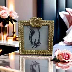 Detailed view of a luxury gold square photo frame showcasing a hand-drawn art print.
