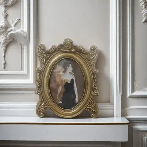 Detailed view of an ornate gold vintage resin photo frame with classical carvings