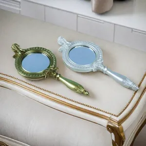 Elegante europäische Vintage-Handspiegel mit kunstvoll geschnitzten Harzgriffen